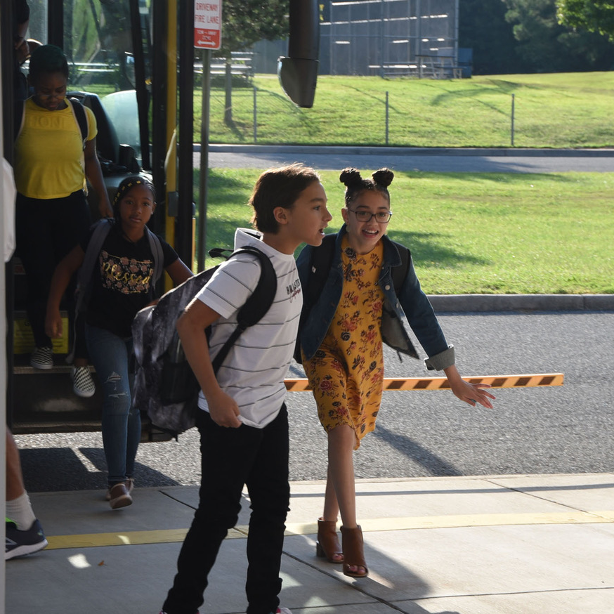 Students getting off the bus