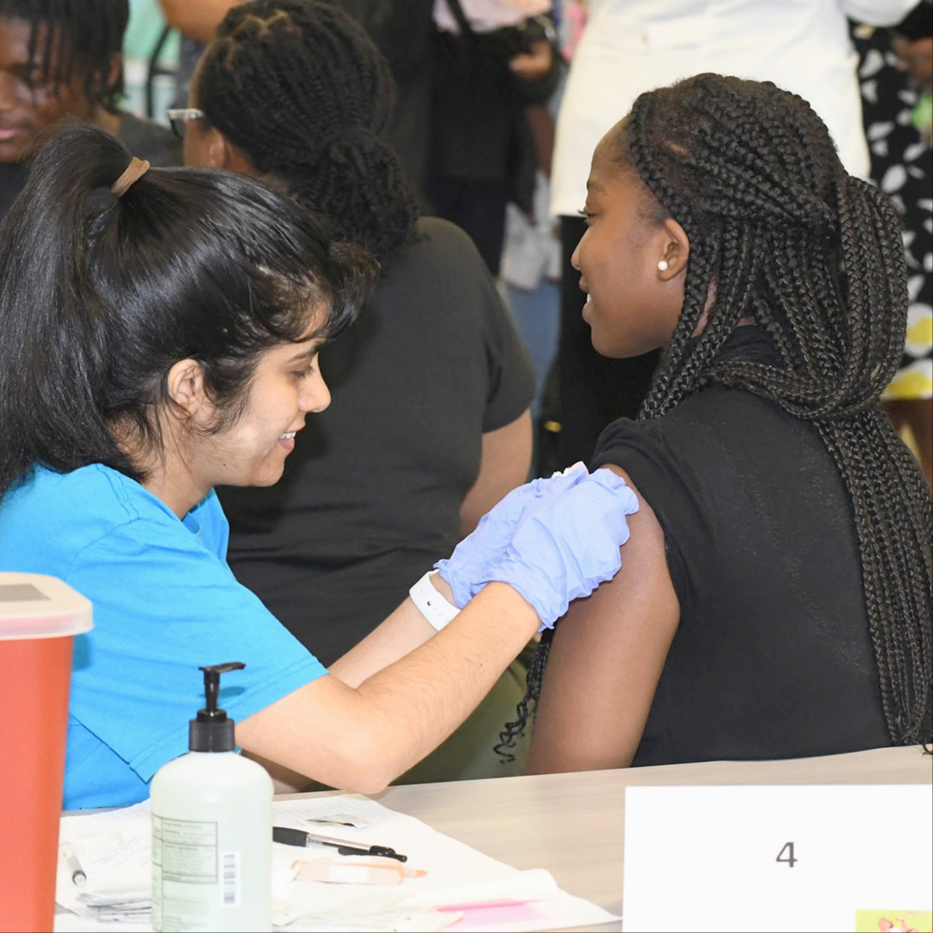 A student getting a vaccine