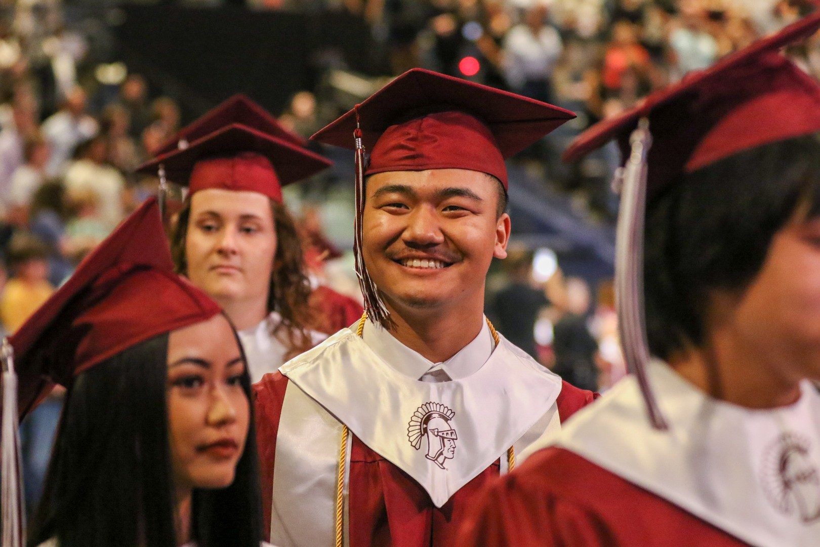 picture of students in red cap and gown