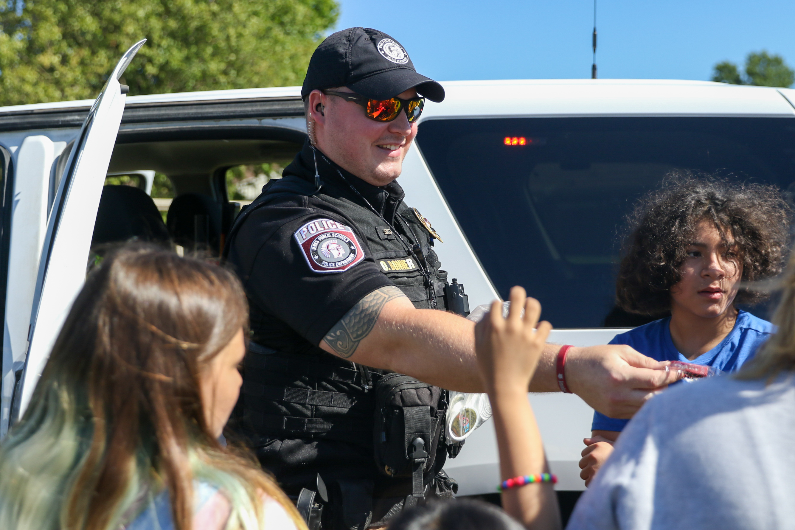 JPS police officer interacting with students
