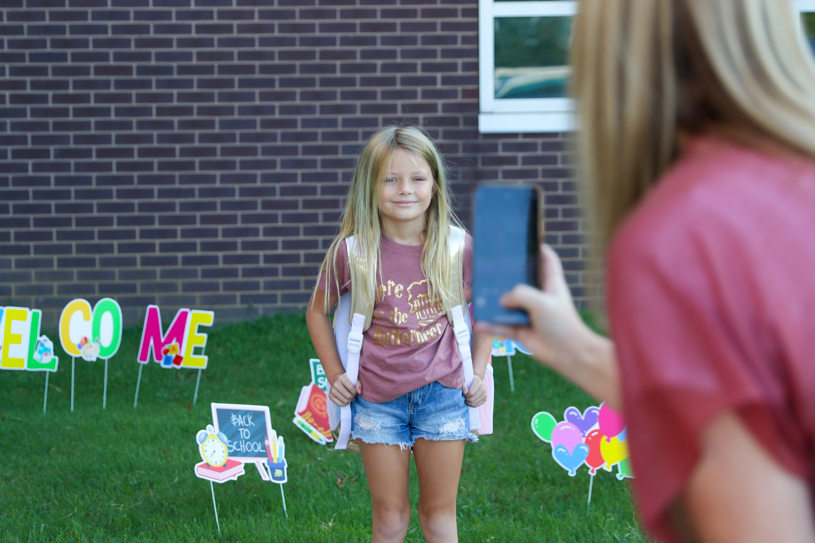 Girl smiling for first day picture