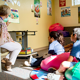 A teacher reading to a class