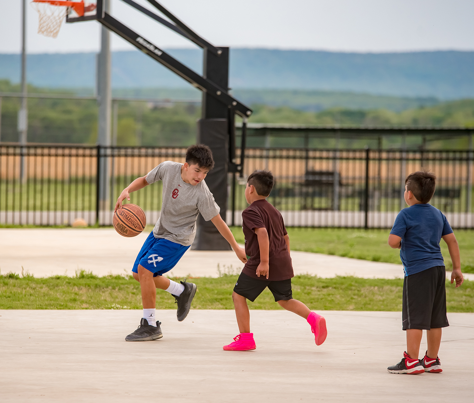 Students playing basketball outside