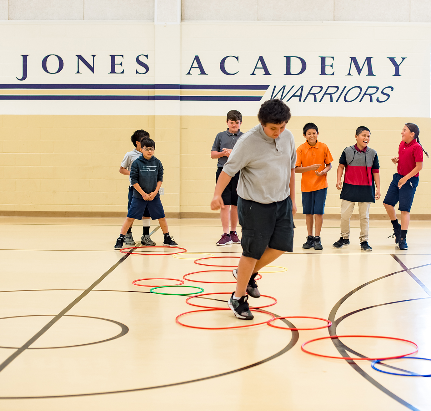 Students playing a game in the gym