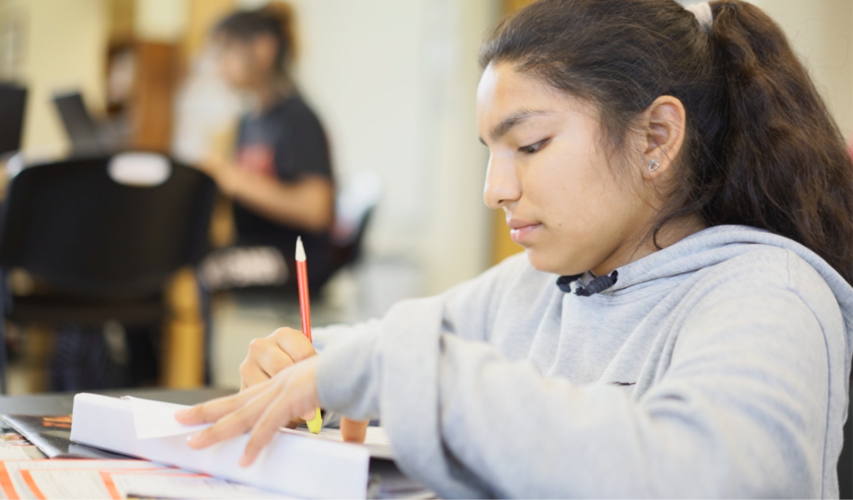 An older student working on an assignment