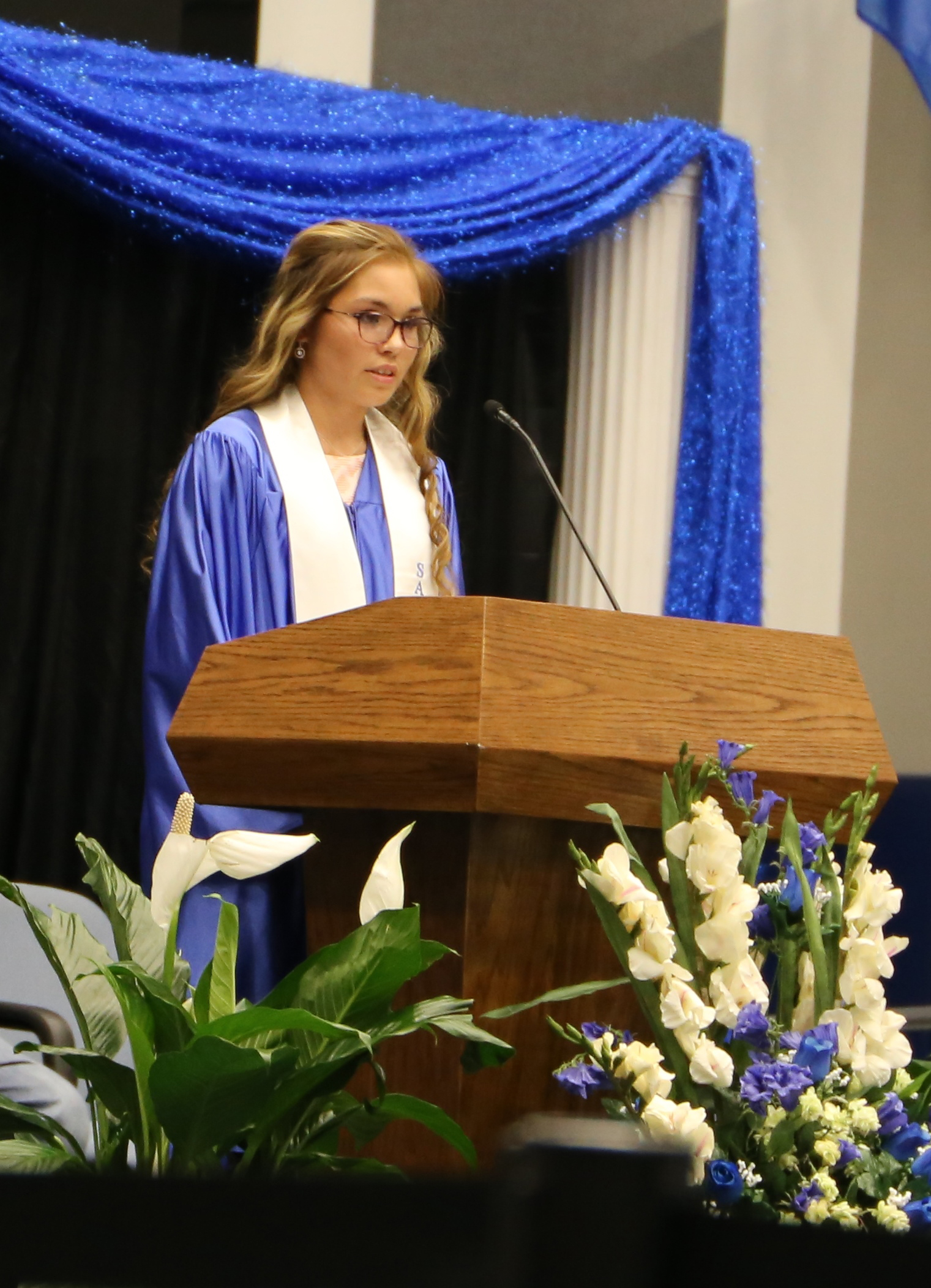 A graduate speaking to the class