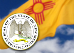 Picture of state of new mexico crest next to the flag of new mexico