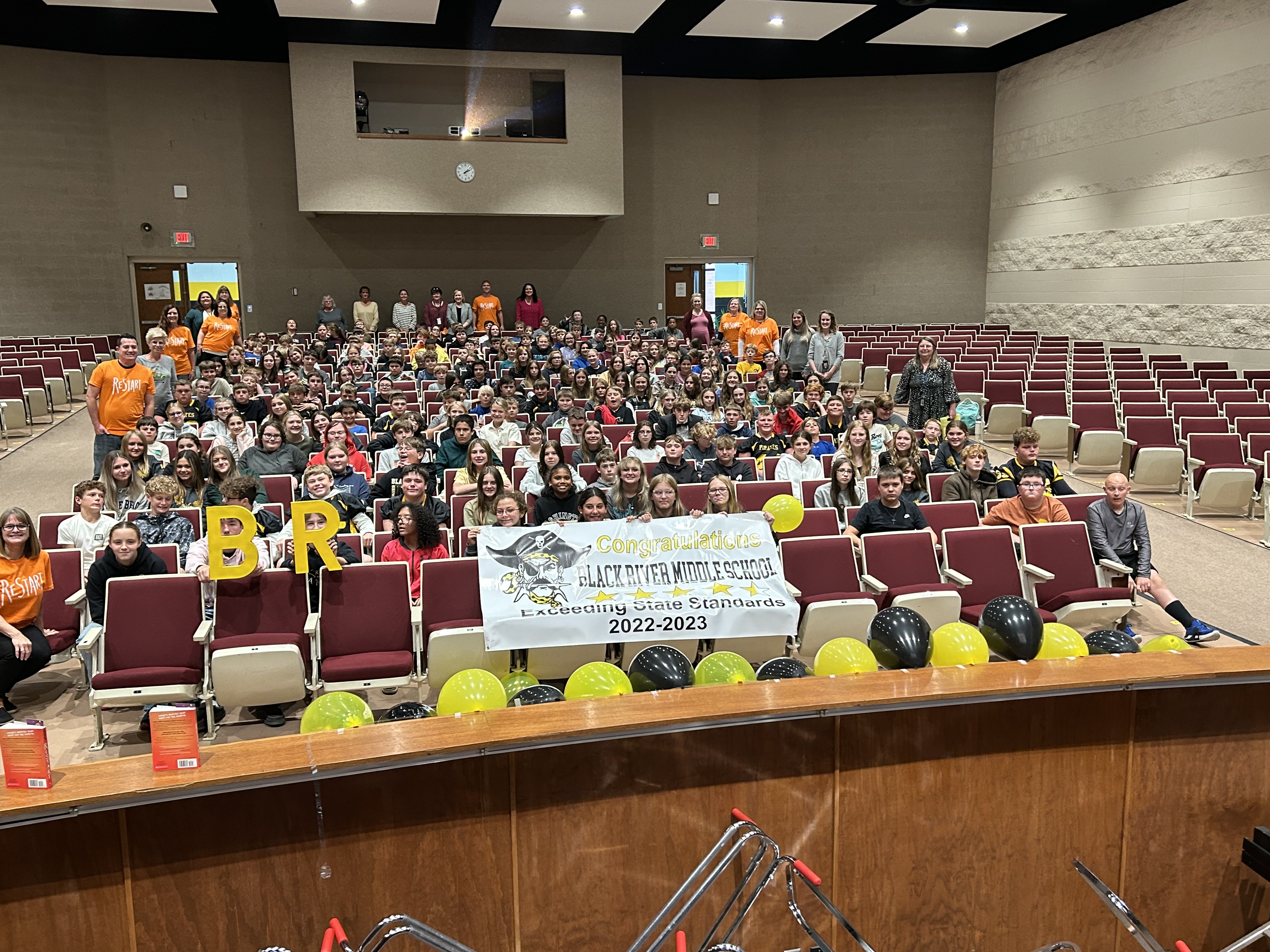 staff and students with 4.5 stars banner 