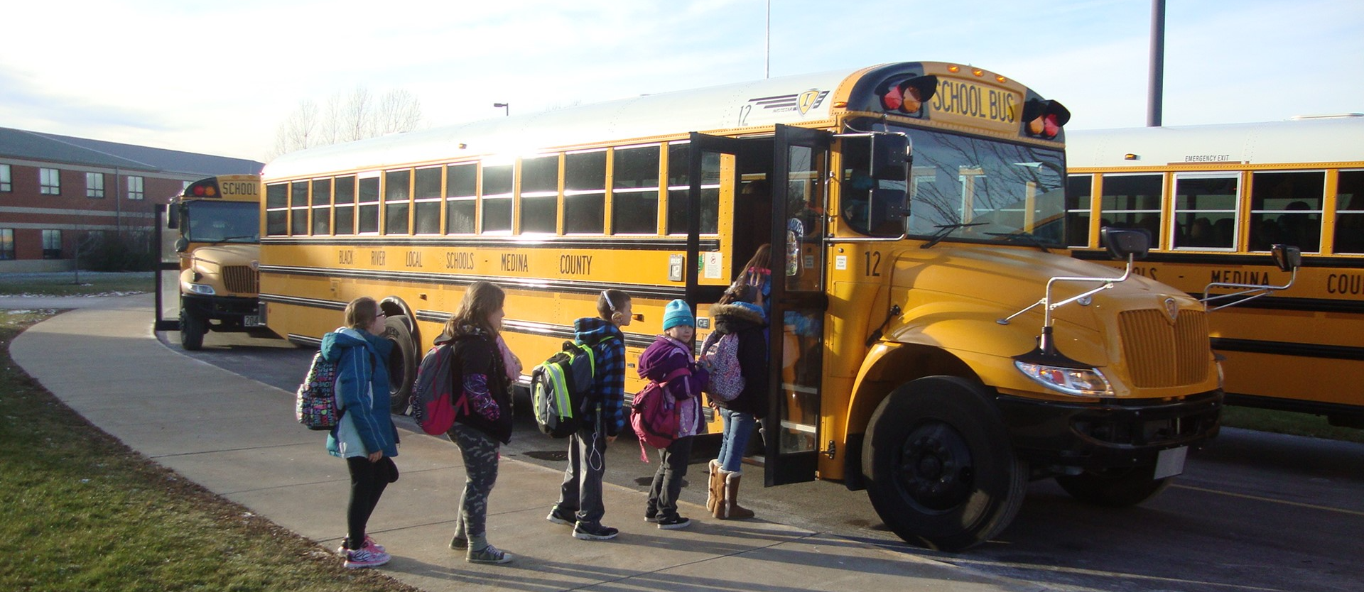 Students boarding a school bus