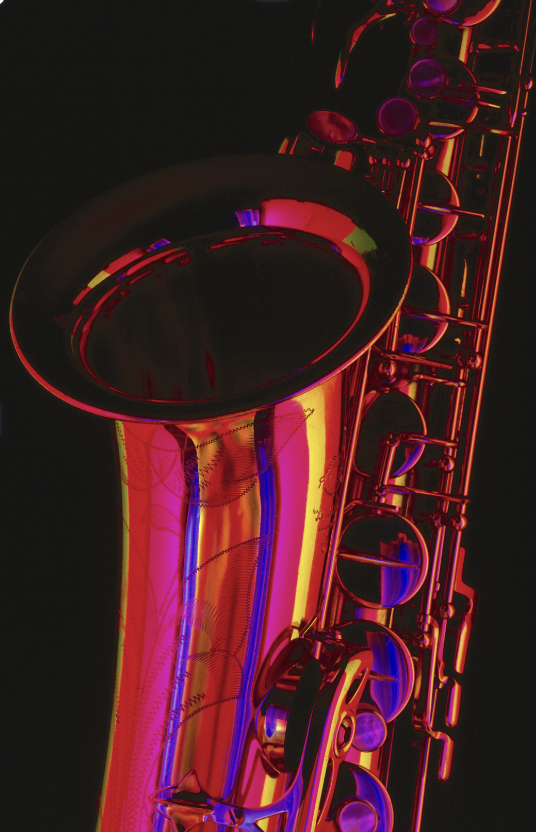 Up Close image of saxophone in red lighting 