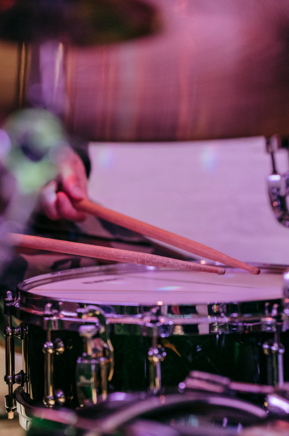 Up close image of person playing drums