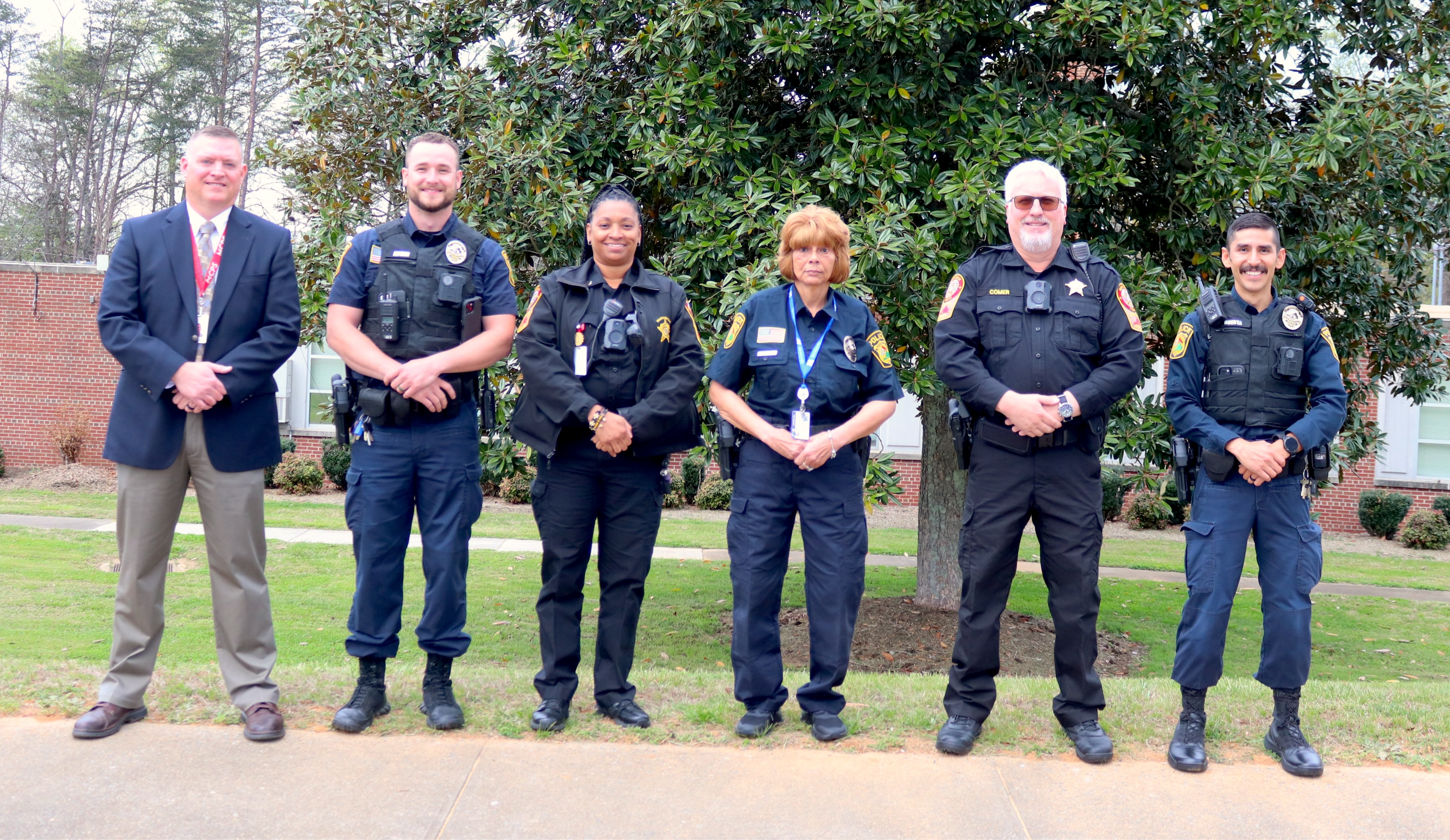 School SROs pose with district security directory