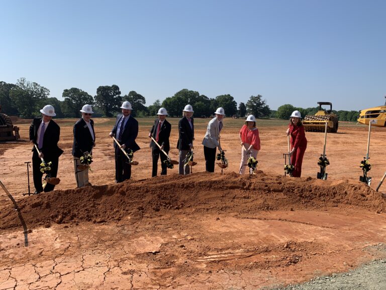 This is a picture of community leaders digging at the groundbreaking event for the new Southeast Alamance High School.
