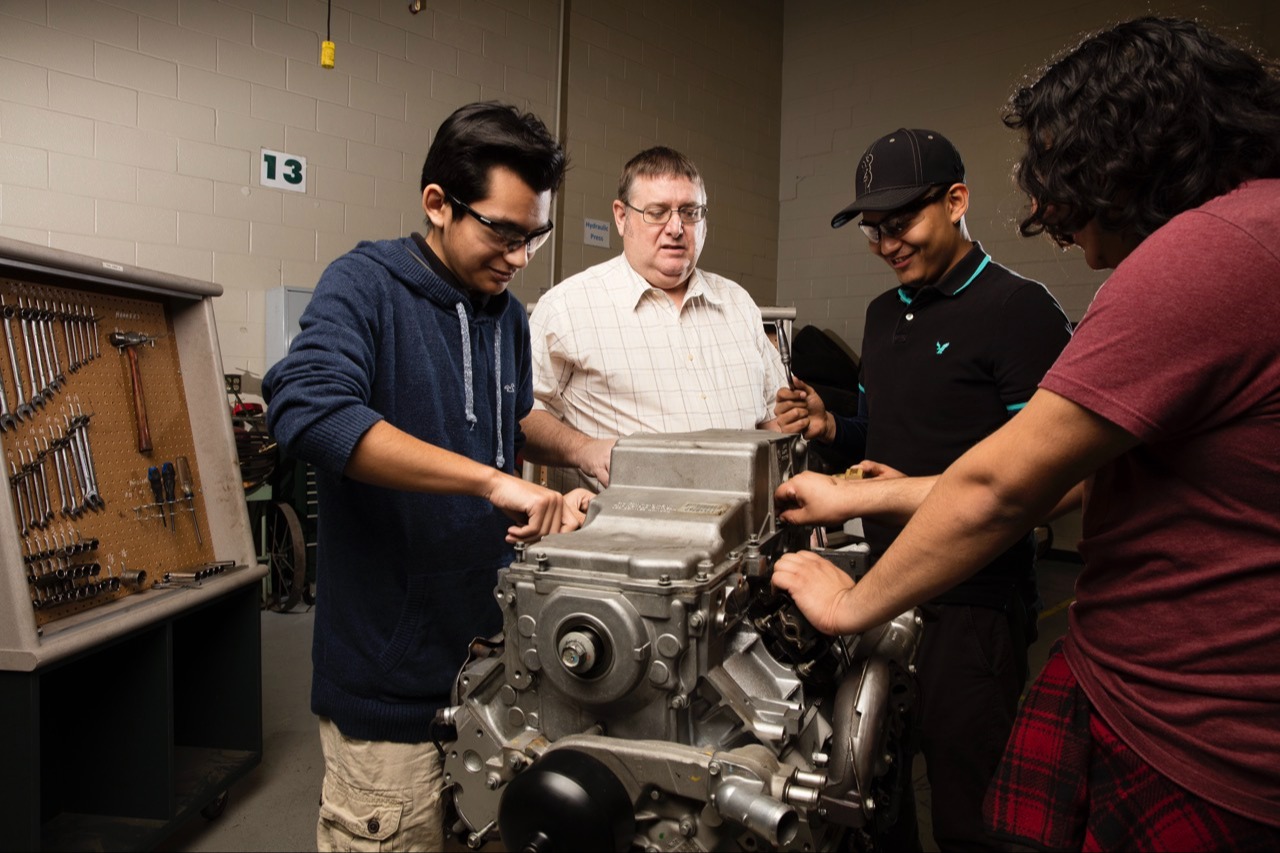 Students working on engine