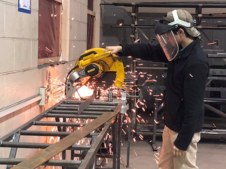 student using saw
