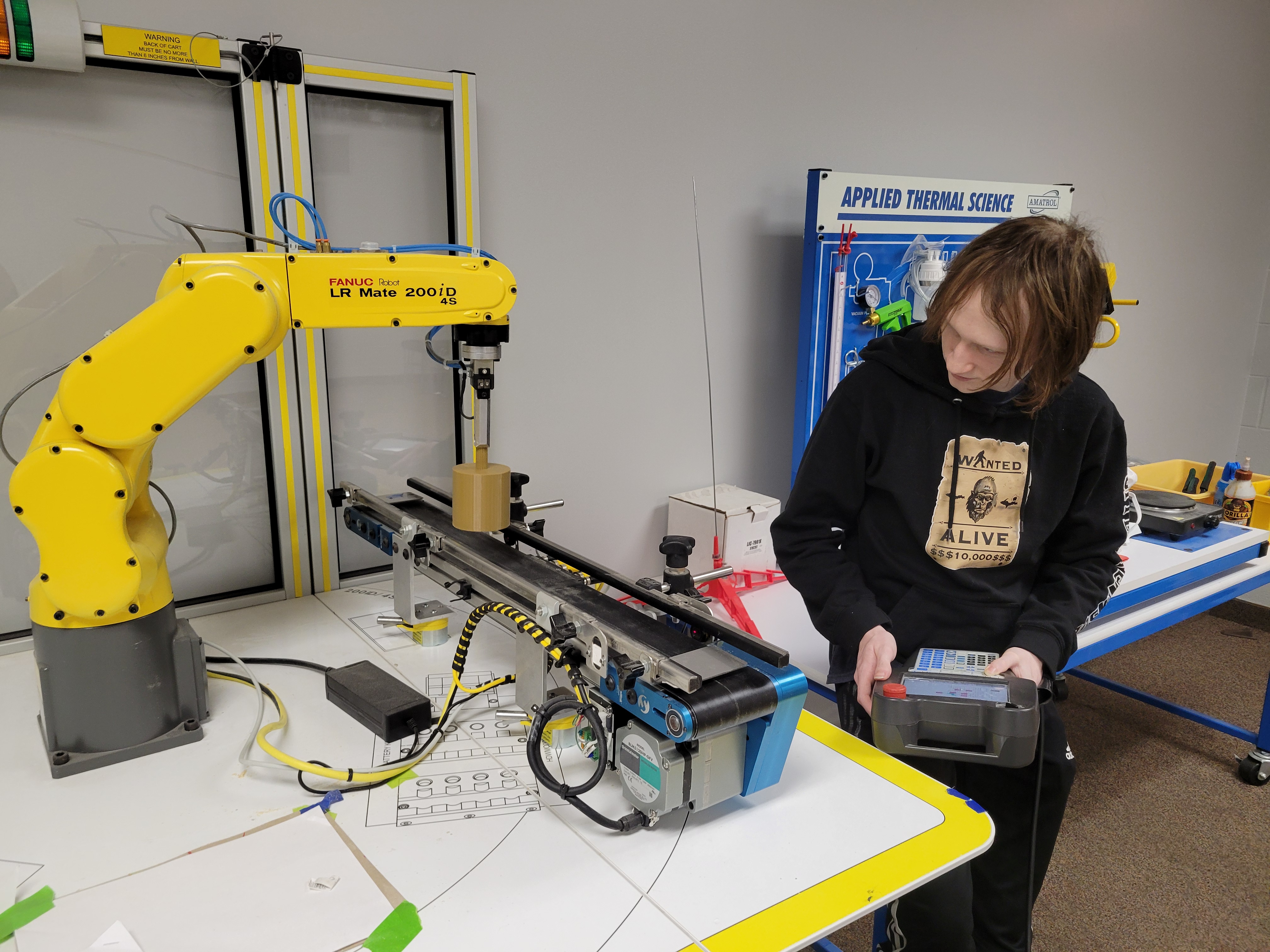 Samuel Bacon and the FANUC robotic arm