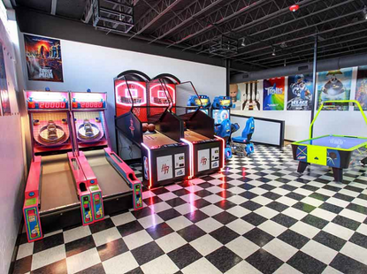 arcade with ski ball and basketball games and checked floor