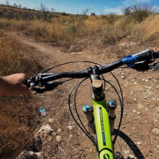 Bike on dirt trail on sunny day