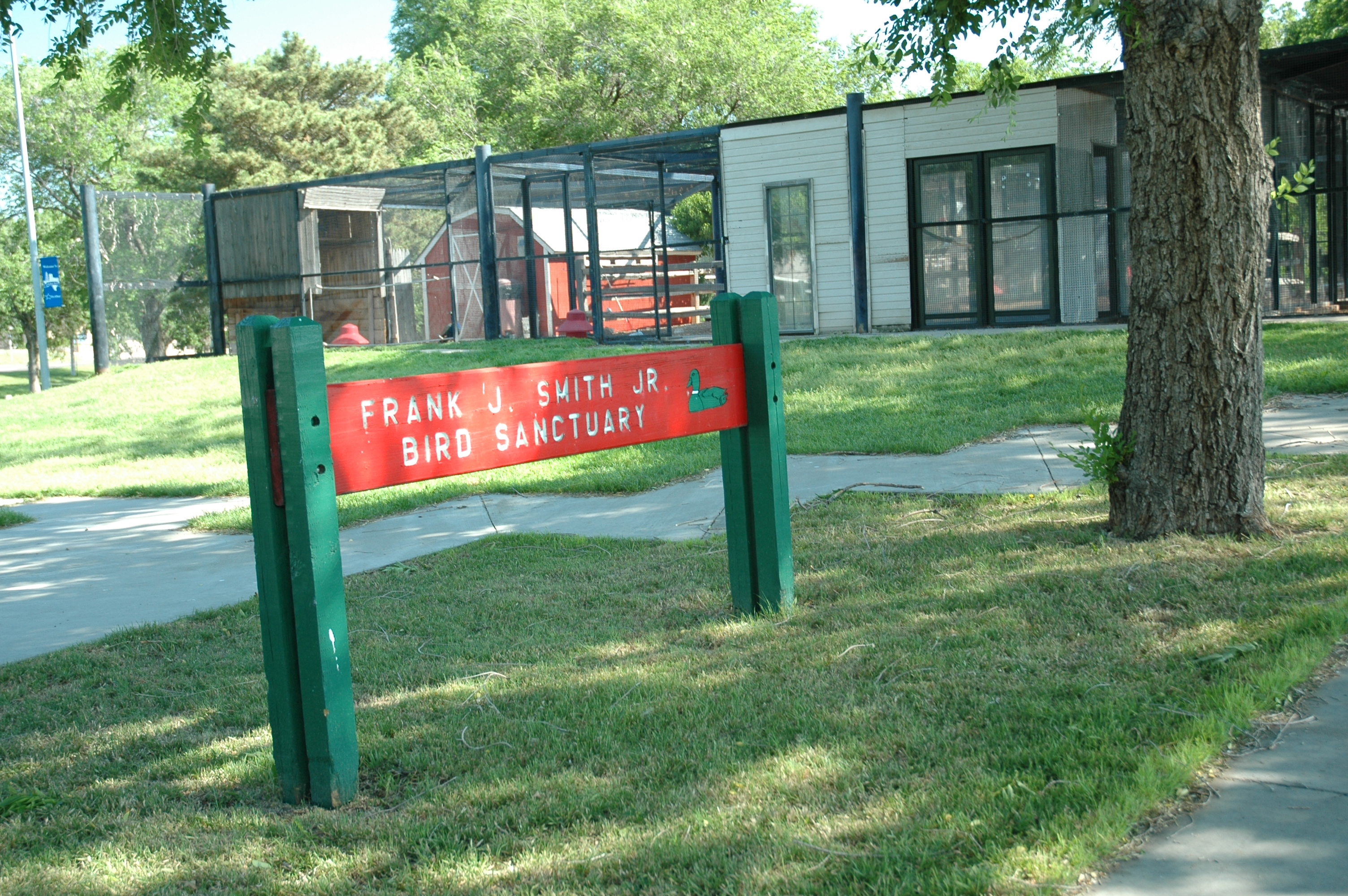 red sign in park for Huber Park Bird sanctuary