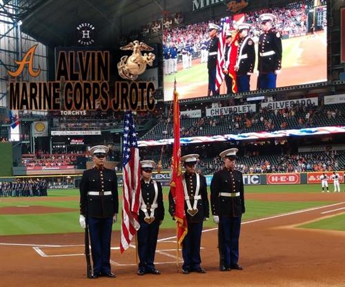 MCJROTC at a baseball game presenting the colors