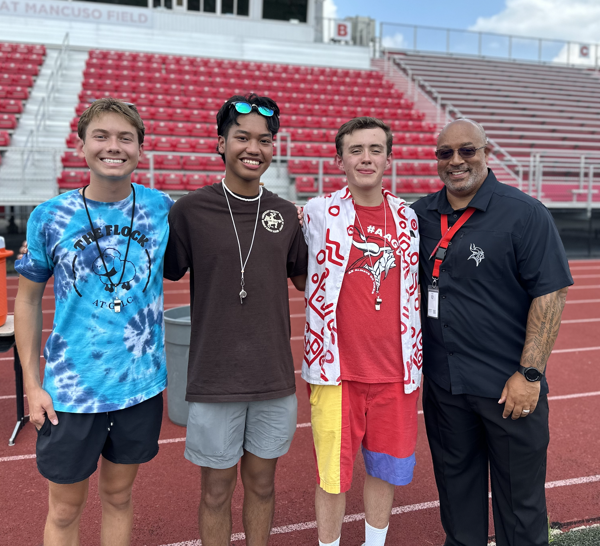 Pride of Princeton Marching Band Drum Majors with Superintendent Elgin Card