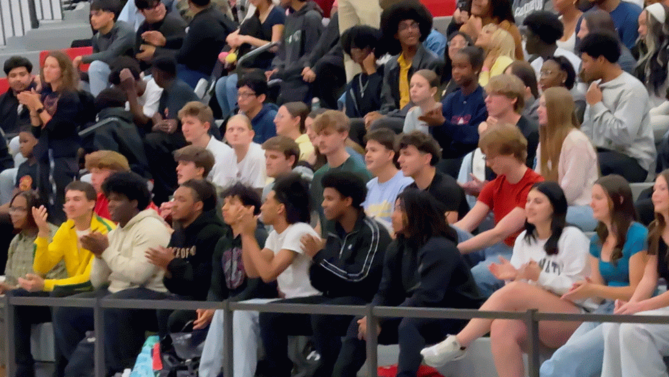 Students cheering at the Boys Basketball State Championship Pep Rally