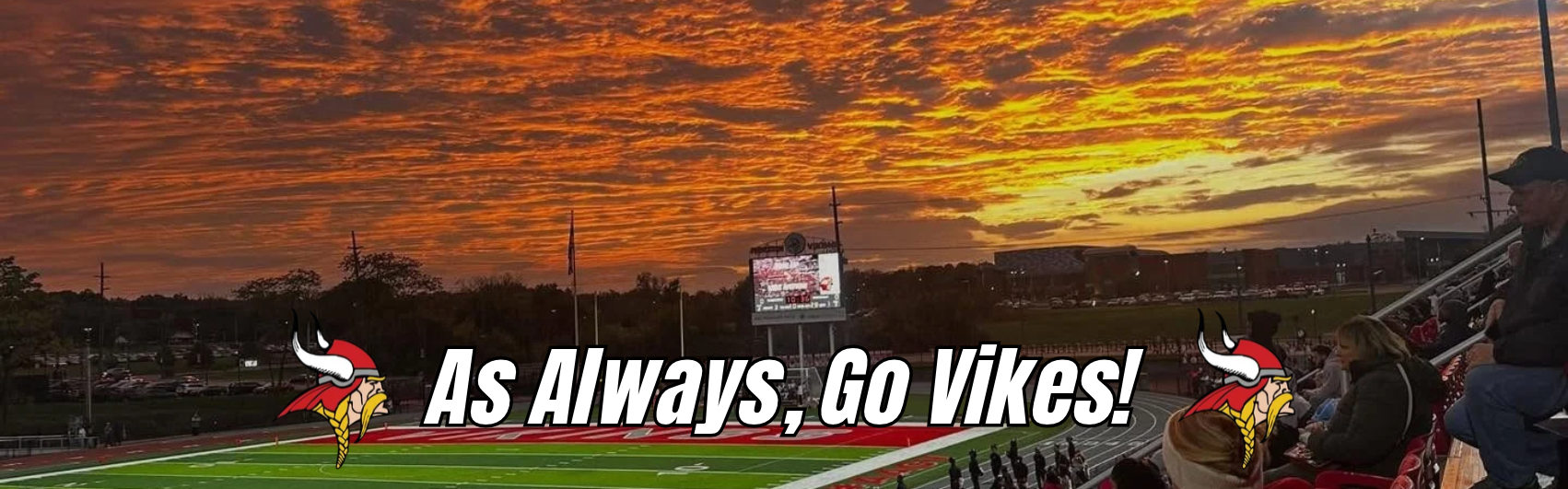 Gorgeous orange sunset over Pat Mancuso field with the words "As Always, Go Vikes" in white text and the Princeton Viking head logo on either side of the text.