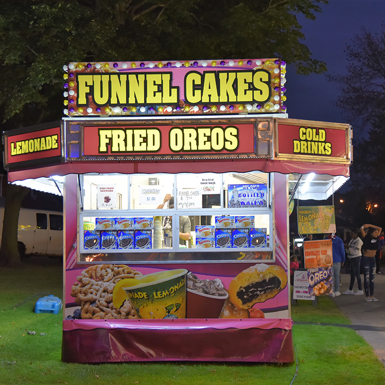 Funnel cakes food stand with lights