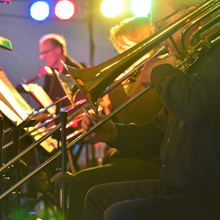 musicians playing trombones