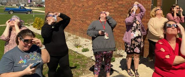 Staff looking at the eclipse