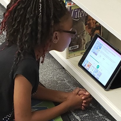A student looking at a tablet