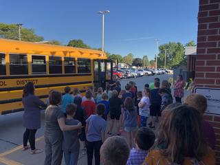 students getting into school bus