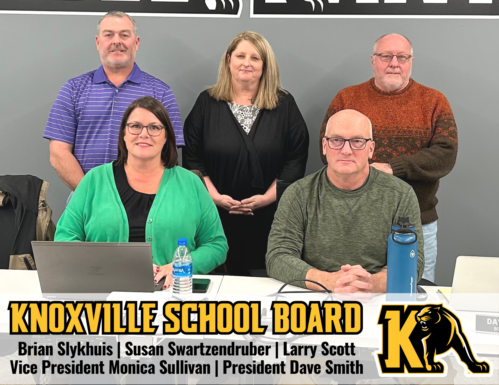 5 Knoxville school board members posing at a computer desk