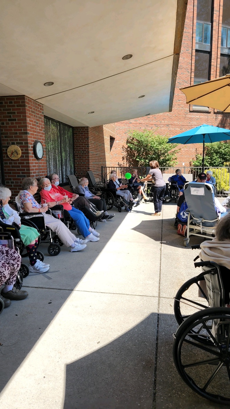 elderly on patio in wheelchairs