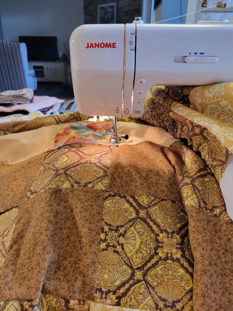 sewing machine with quilt on it
