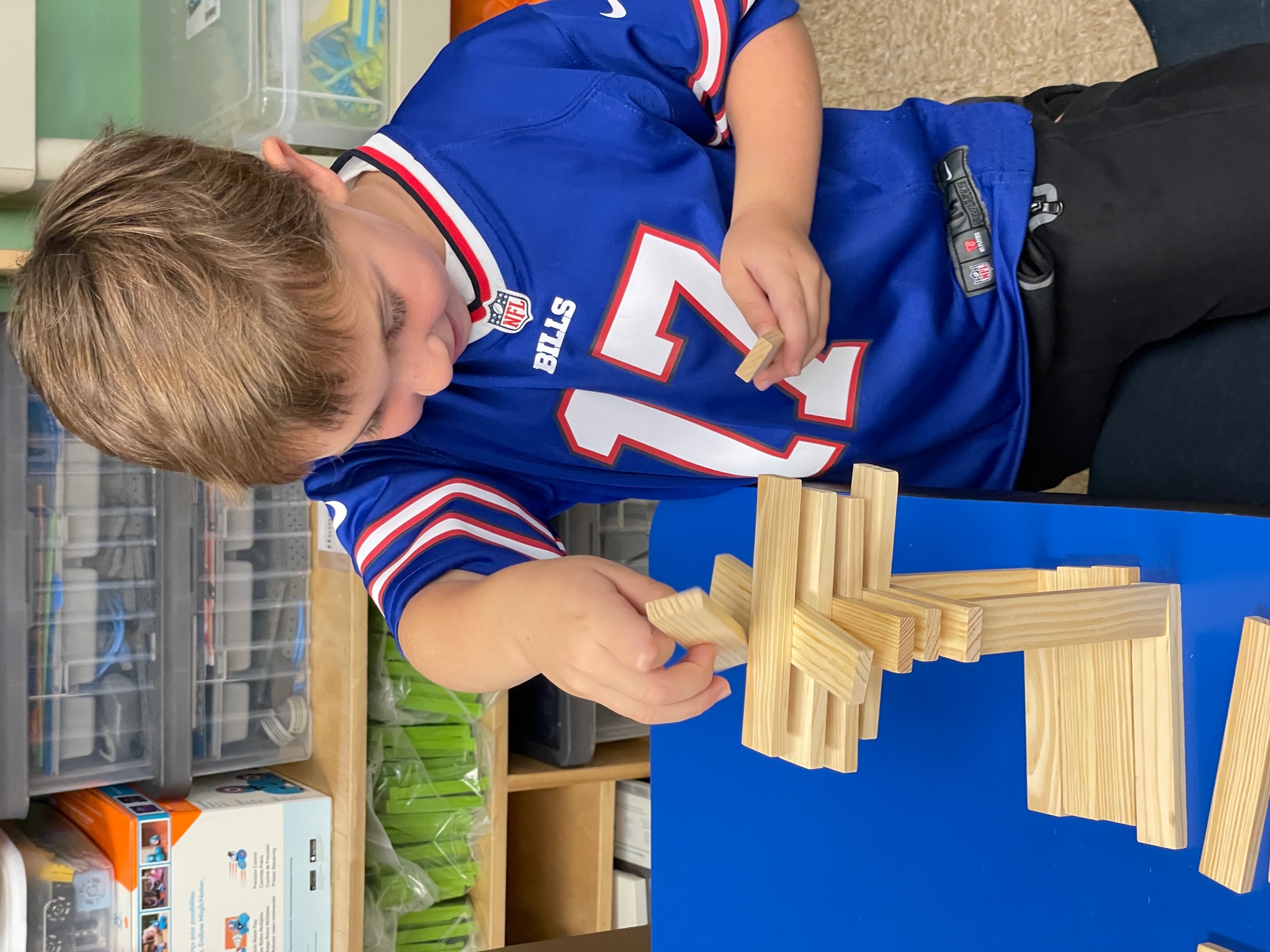 child building with wooden blocks