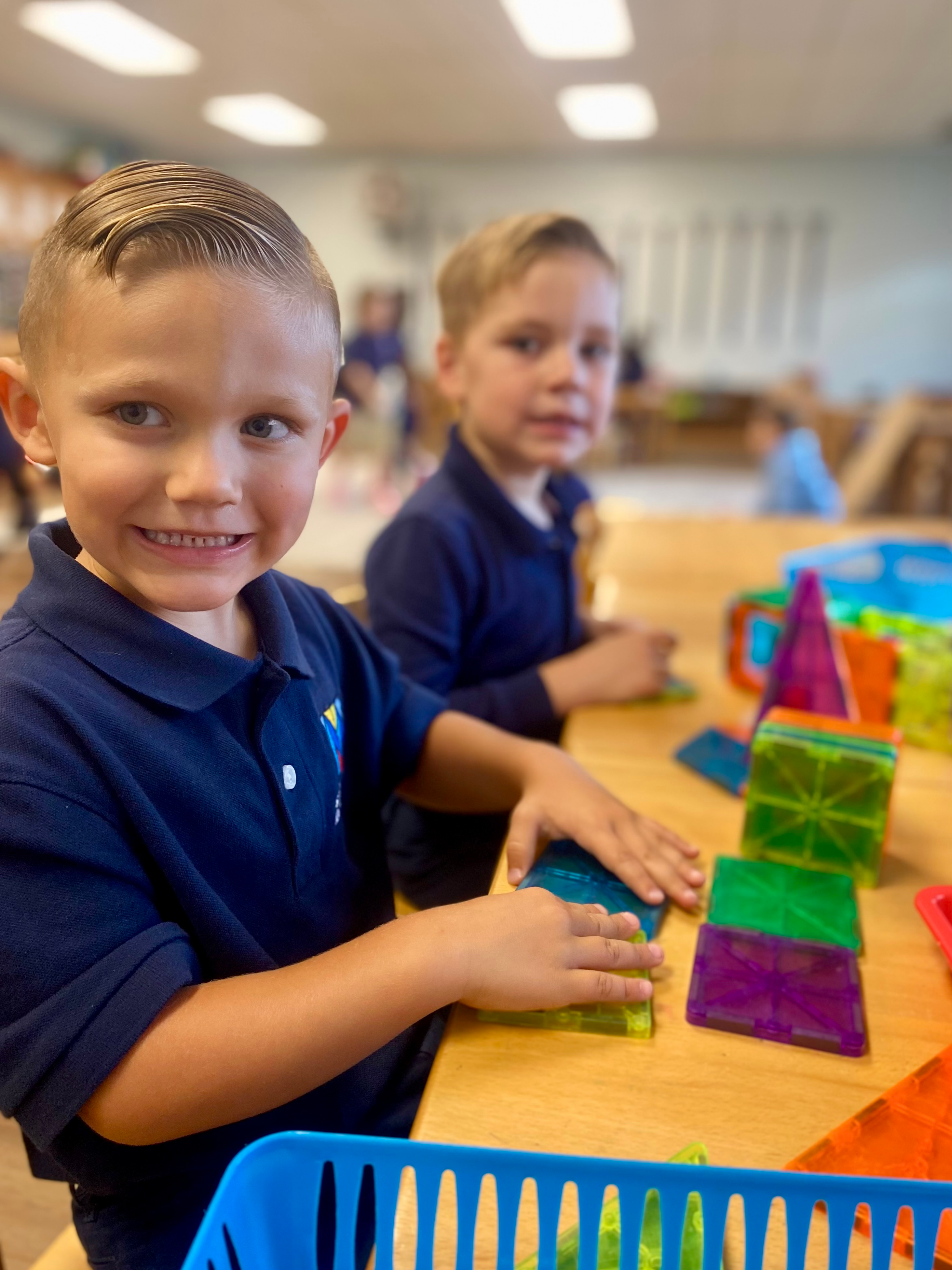 Children working with magnetic blocks