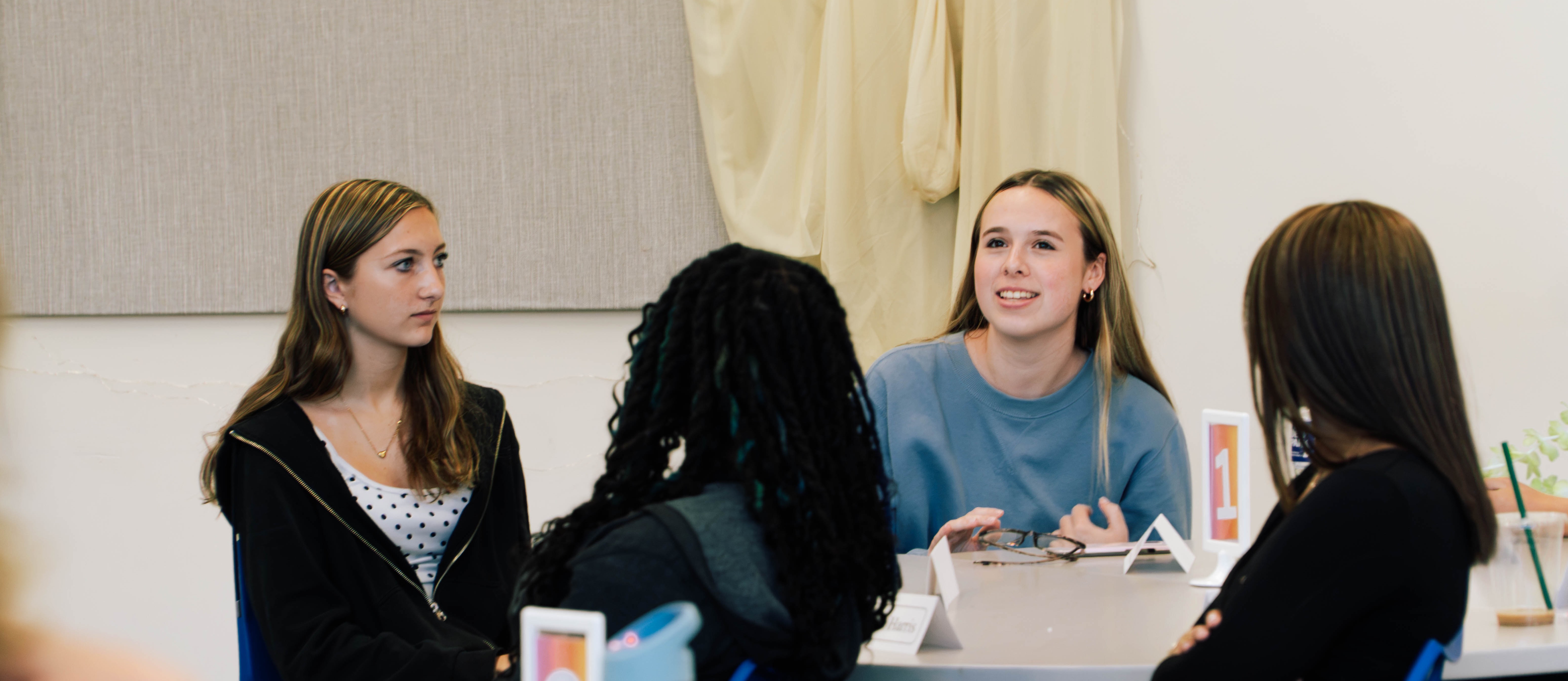 Students discussing in the library