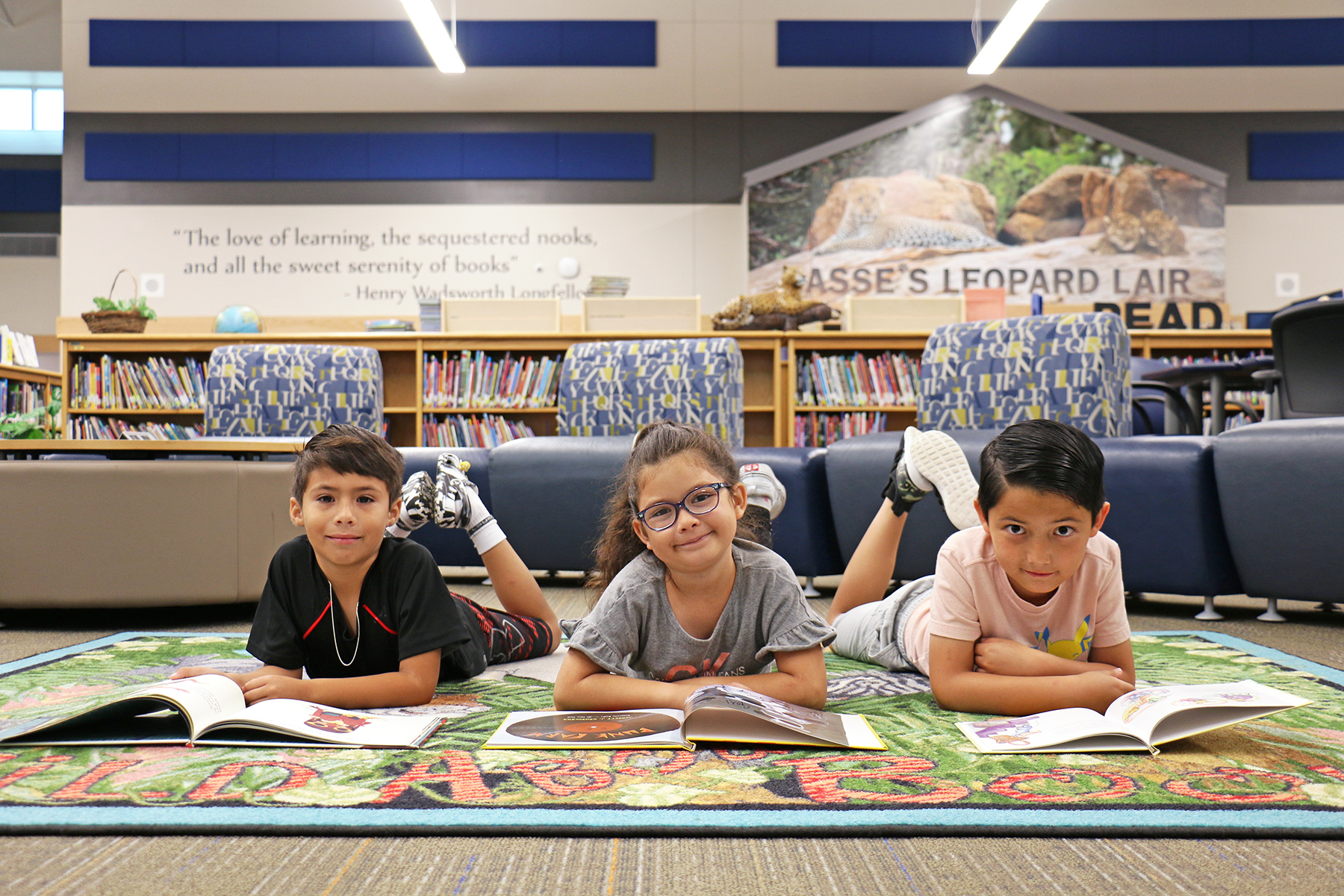 Kids laying on floor of library