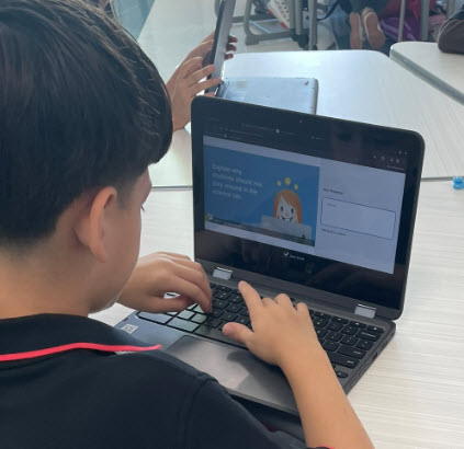 kid with computer
