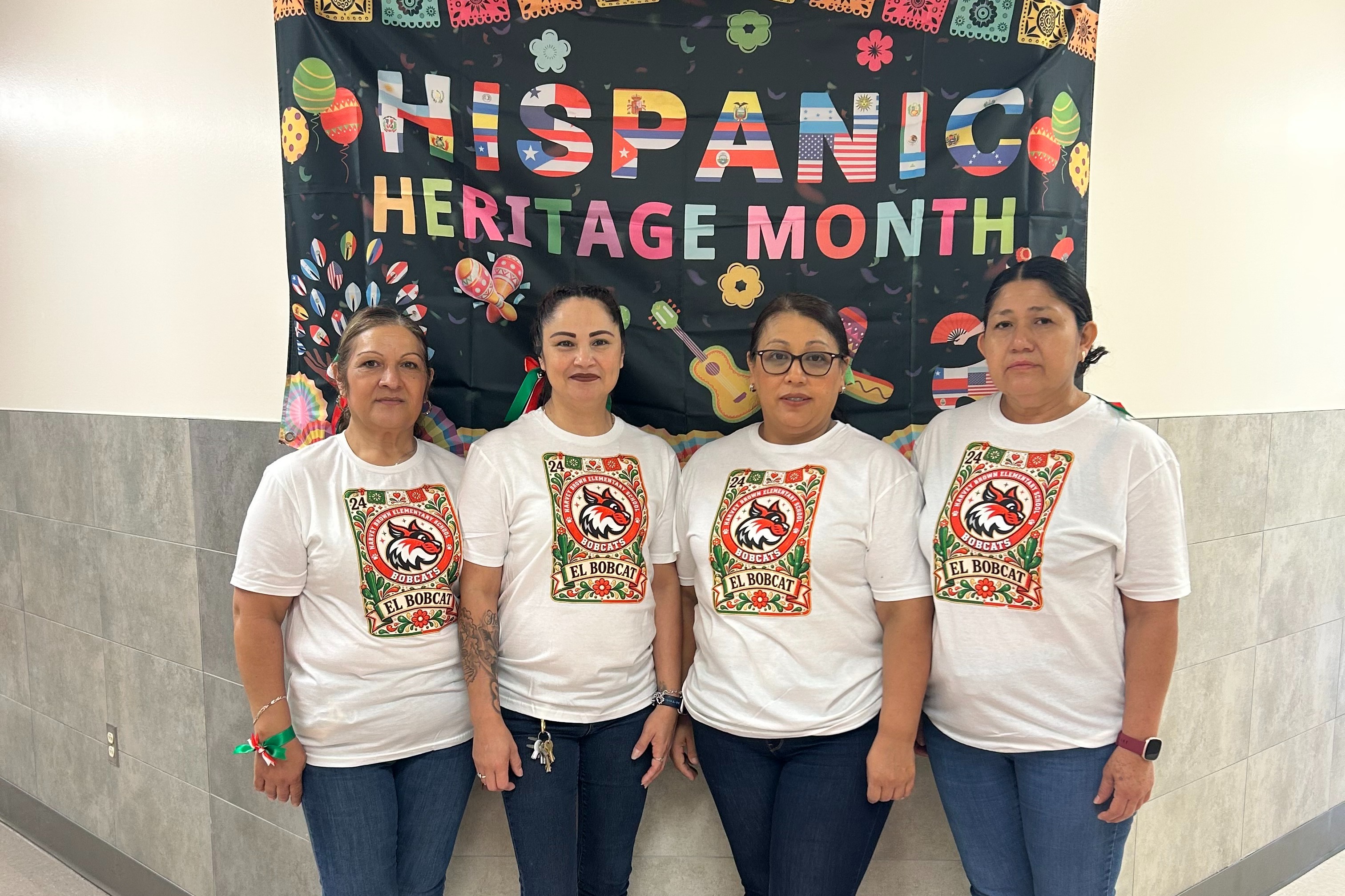Four custodians at Harvey Brown for Hispanic Heritage Month