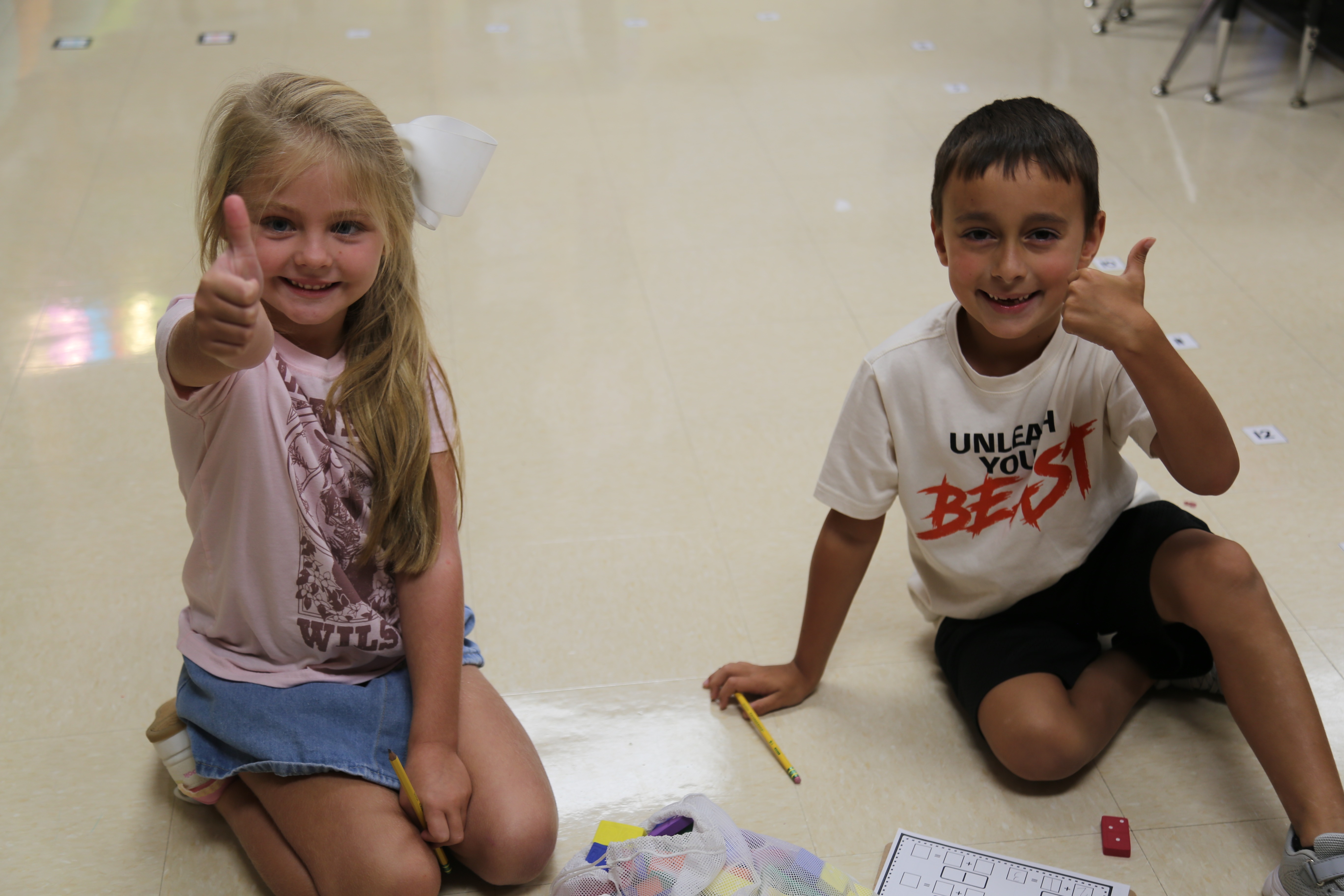 Students giving thumbs up