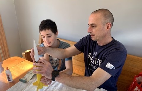 Pete Helfers and son building rocket