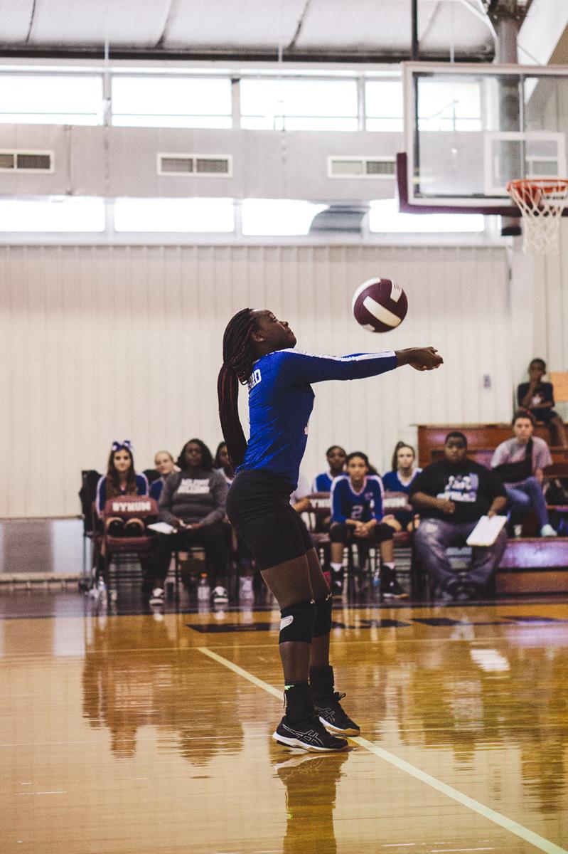 Volleyball player getting ready to pass the ball.