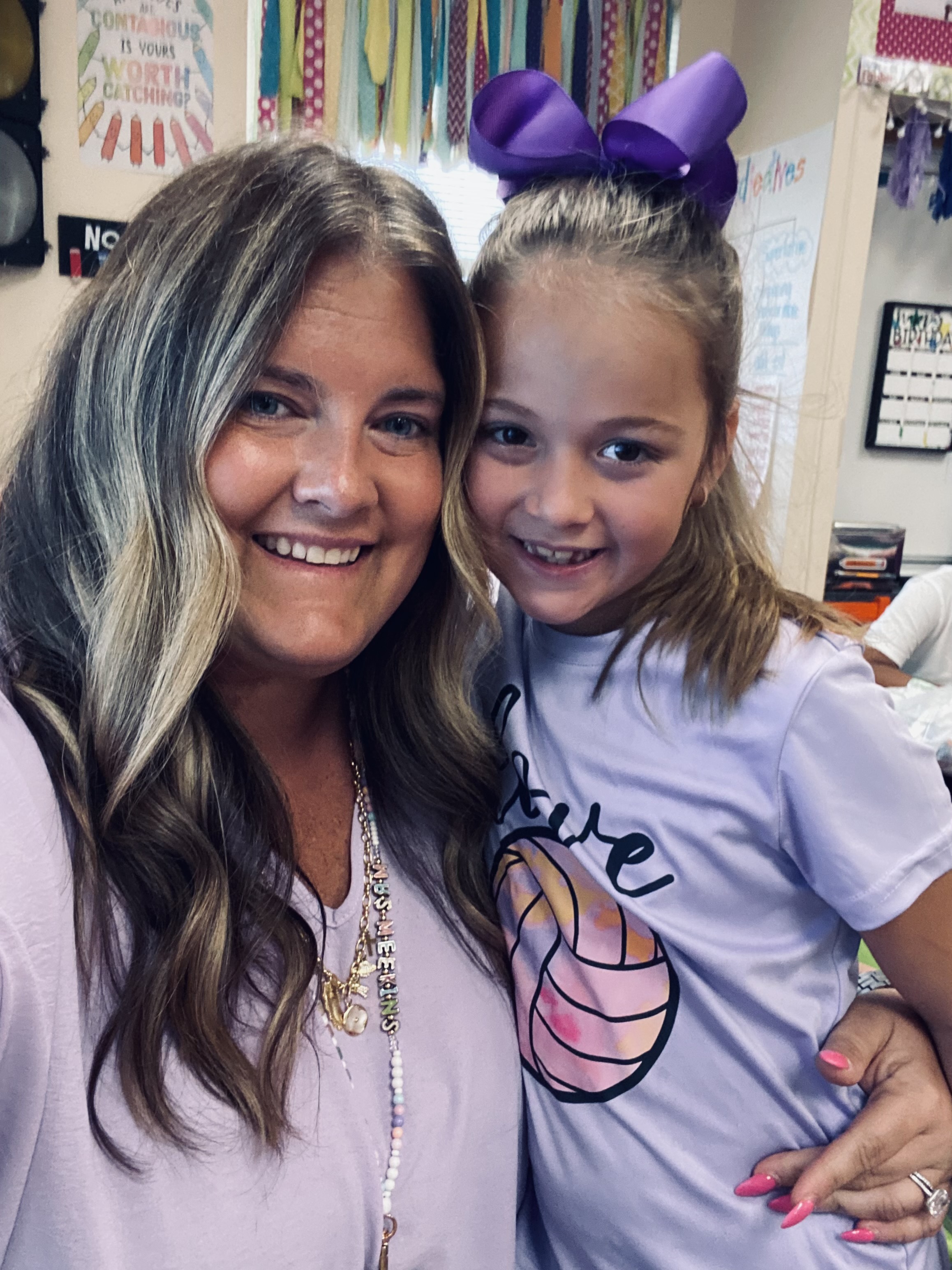 Mrs. Meekins and student wearing purple