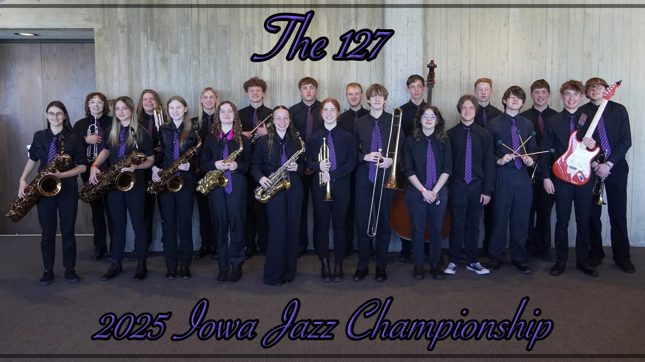Members of "The 127" jazz band pose for a formal 2025 Iowa Jazz Championship portrait in black uniforms and matching purple ties.