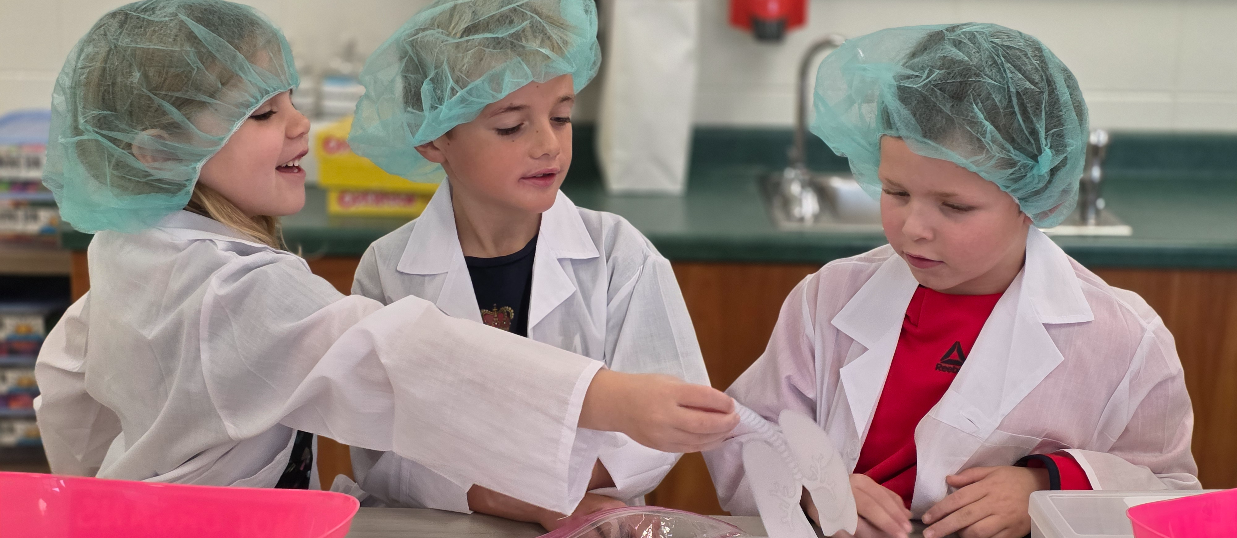 1st graders dressed as surgeons learn about the human body