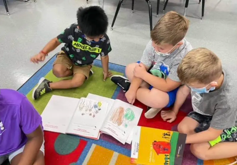 Kindergarten students sharing their work
