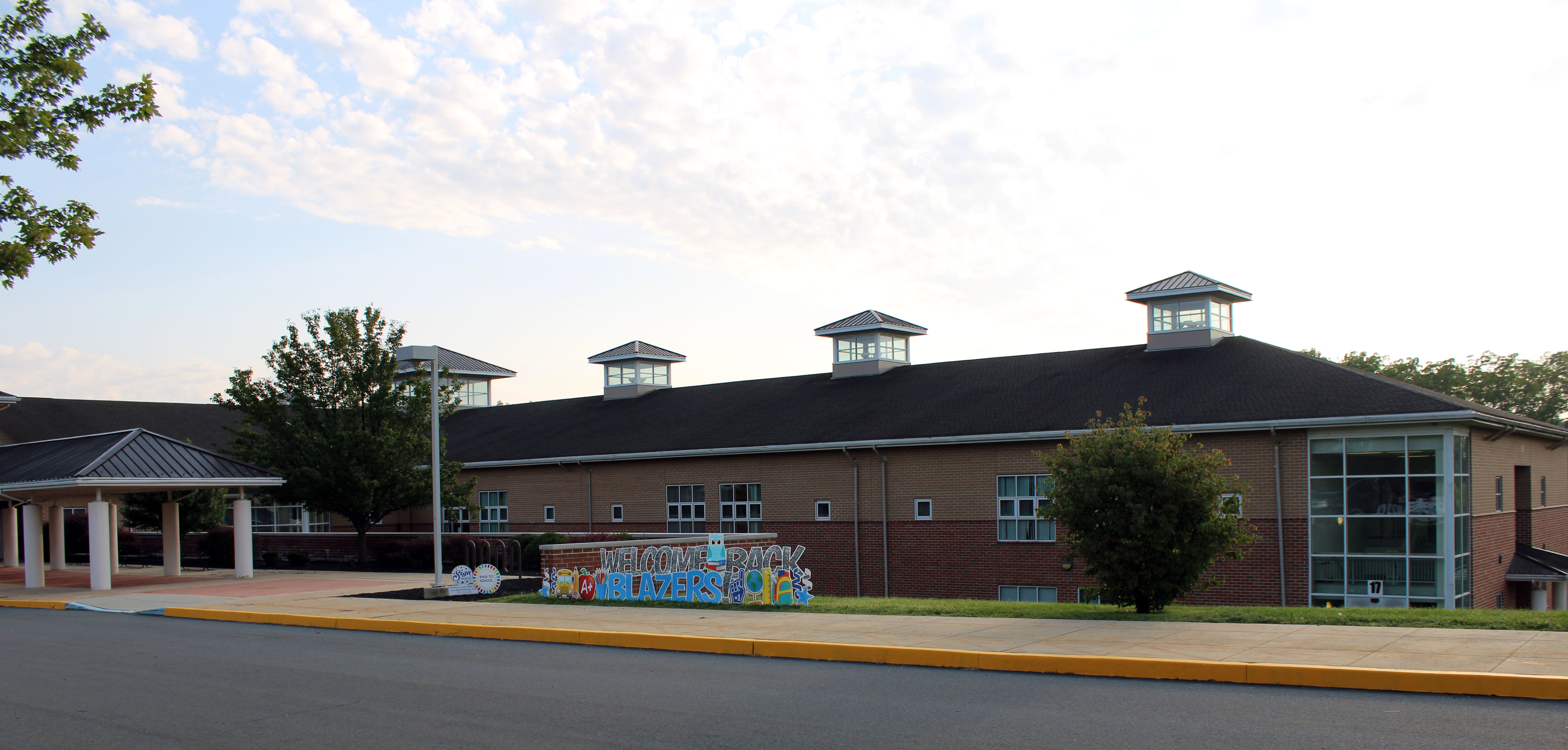 Picture of DBAIC with WELCOME BLAZERS sign.