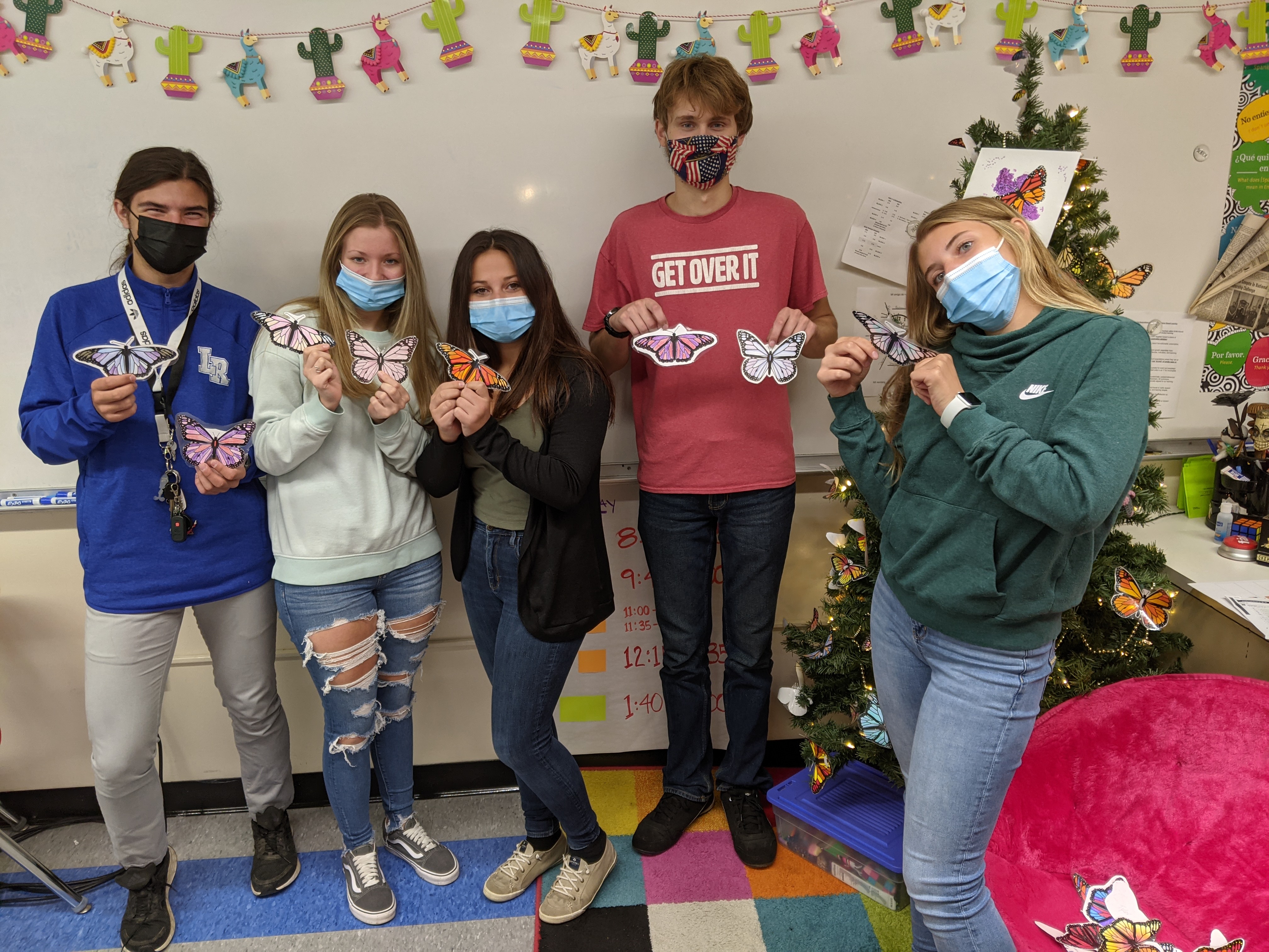 Spanish 4 showing off their butterflies before we send them to Mexico